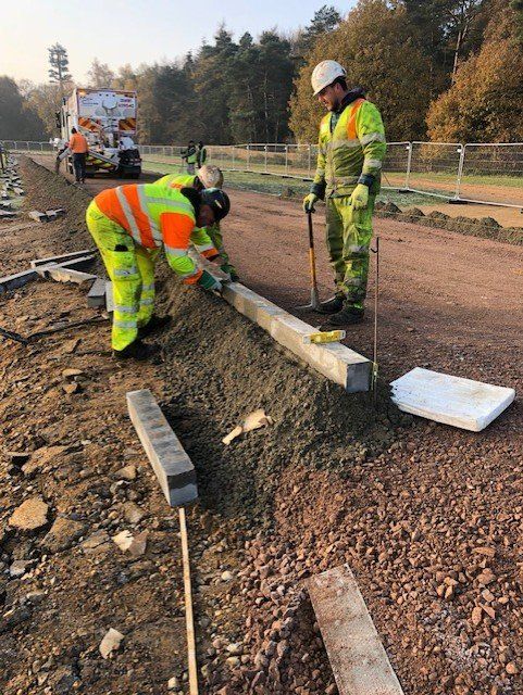 Hazell & Jefferies team members fitting concrete beams in preparation for laying surface treatments.