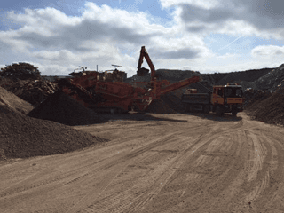 Hazell & Jefferies lorry moving waste within a recycling centre.