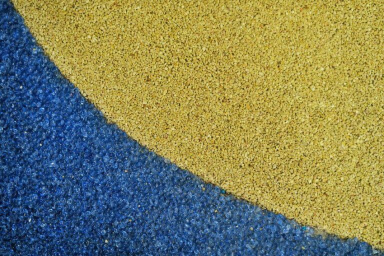 Close up of a yellow and blue resin driveway.